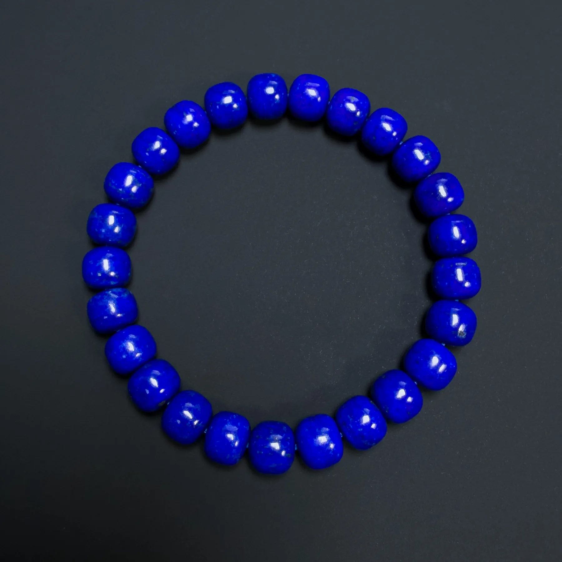 Overhead view of the blue rounded barrel bead bracelet