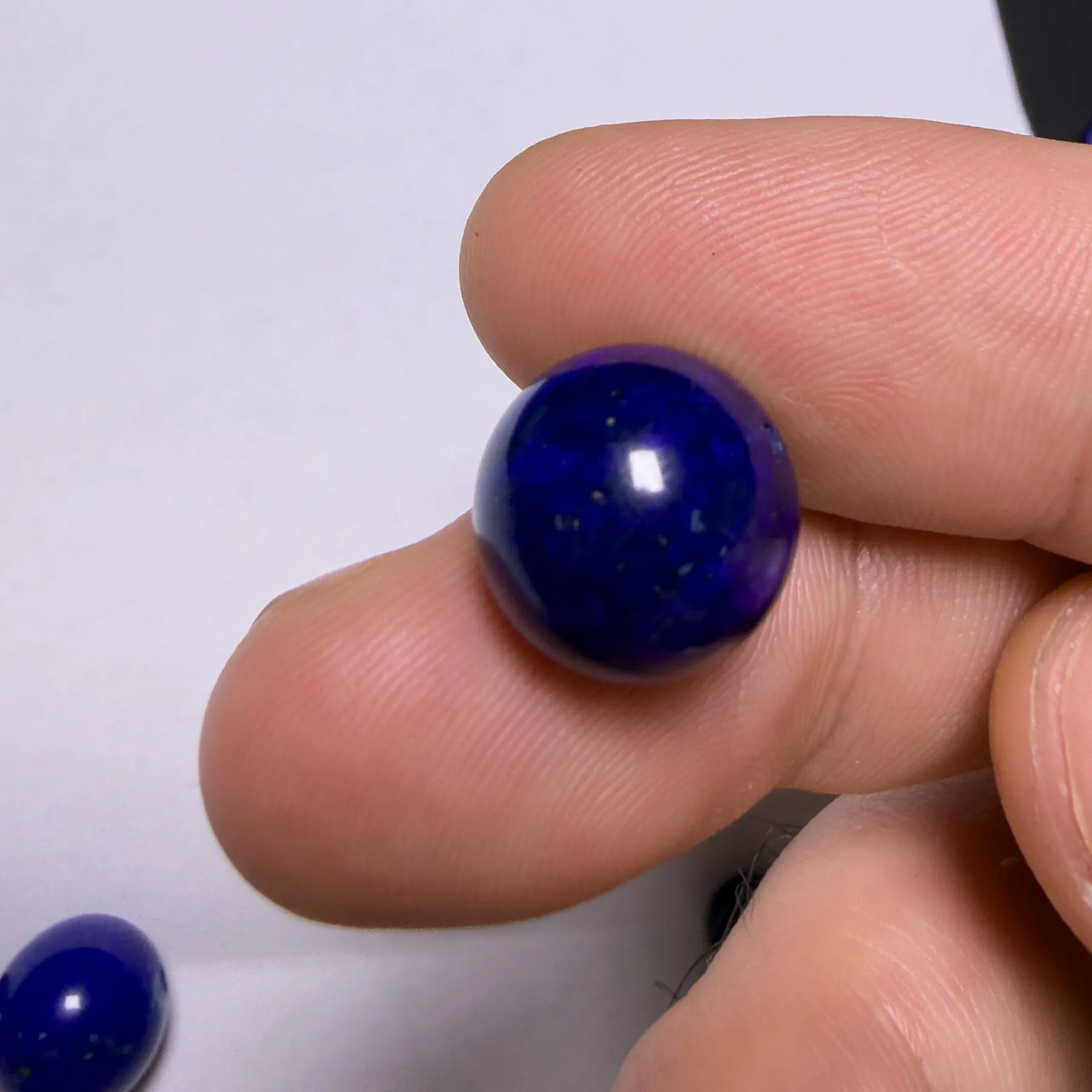 Macro close-up of very dark natural lapis showing blue and near-black areas