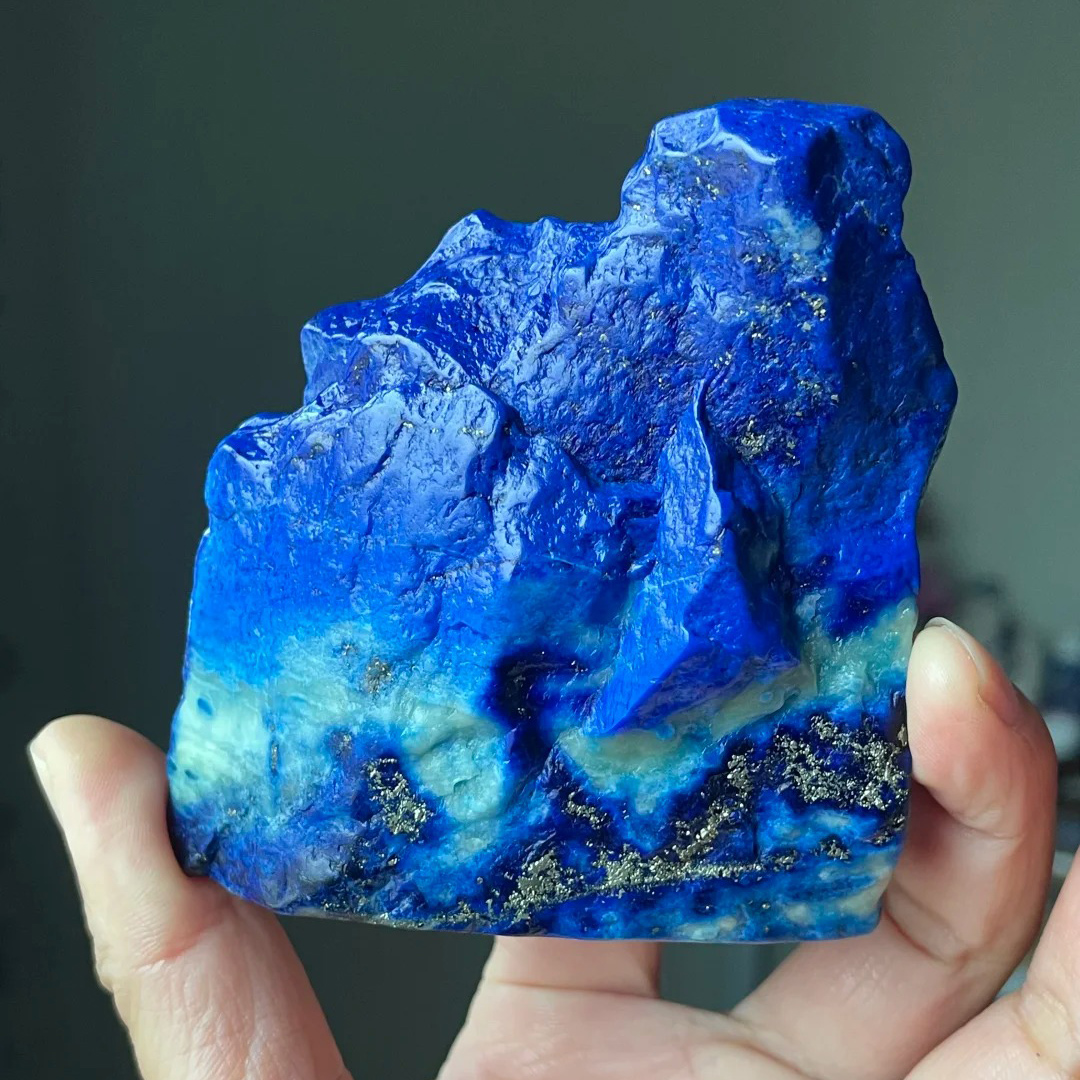 Freeform denim lapis lazuli with vivid blue, pale mineral areas and visible pyrite