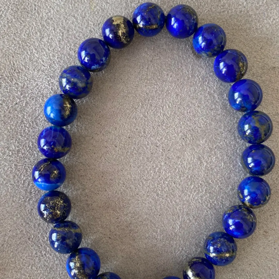 Round lapis lazuli bracelet with large and irregular pyrite areas