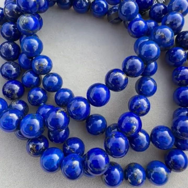Blue lapis lazuli bead strands with different amounts of visible pyrite