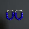 Front view of the royal-blue lapis lazuli beaded hoop earrings with silver posts