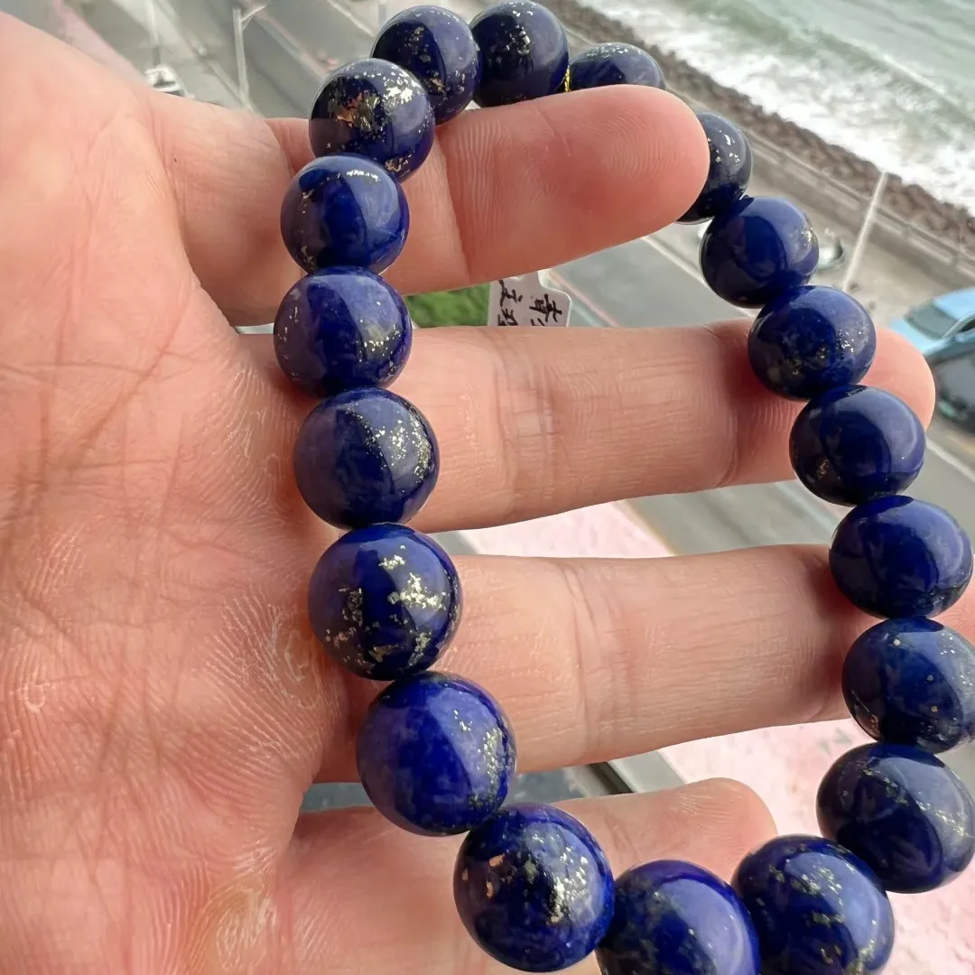 Round lapis lazuli bracelet with visible pyrite clusters on selected beads