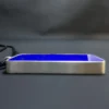 Edge profile of the lapis pendant showing its thin blue face and surrounding silver bezel